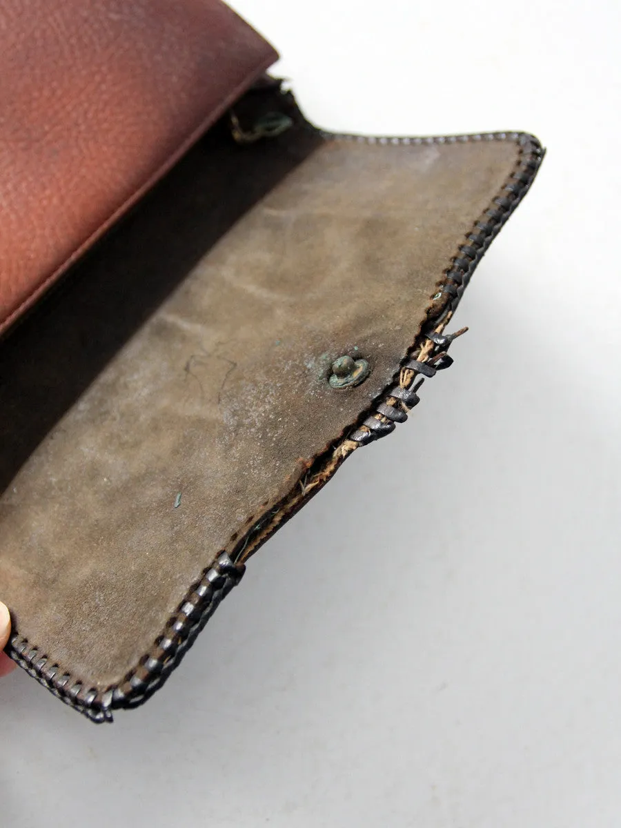 antique leather clutch with art nouveau tooling