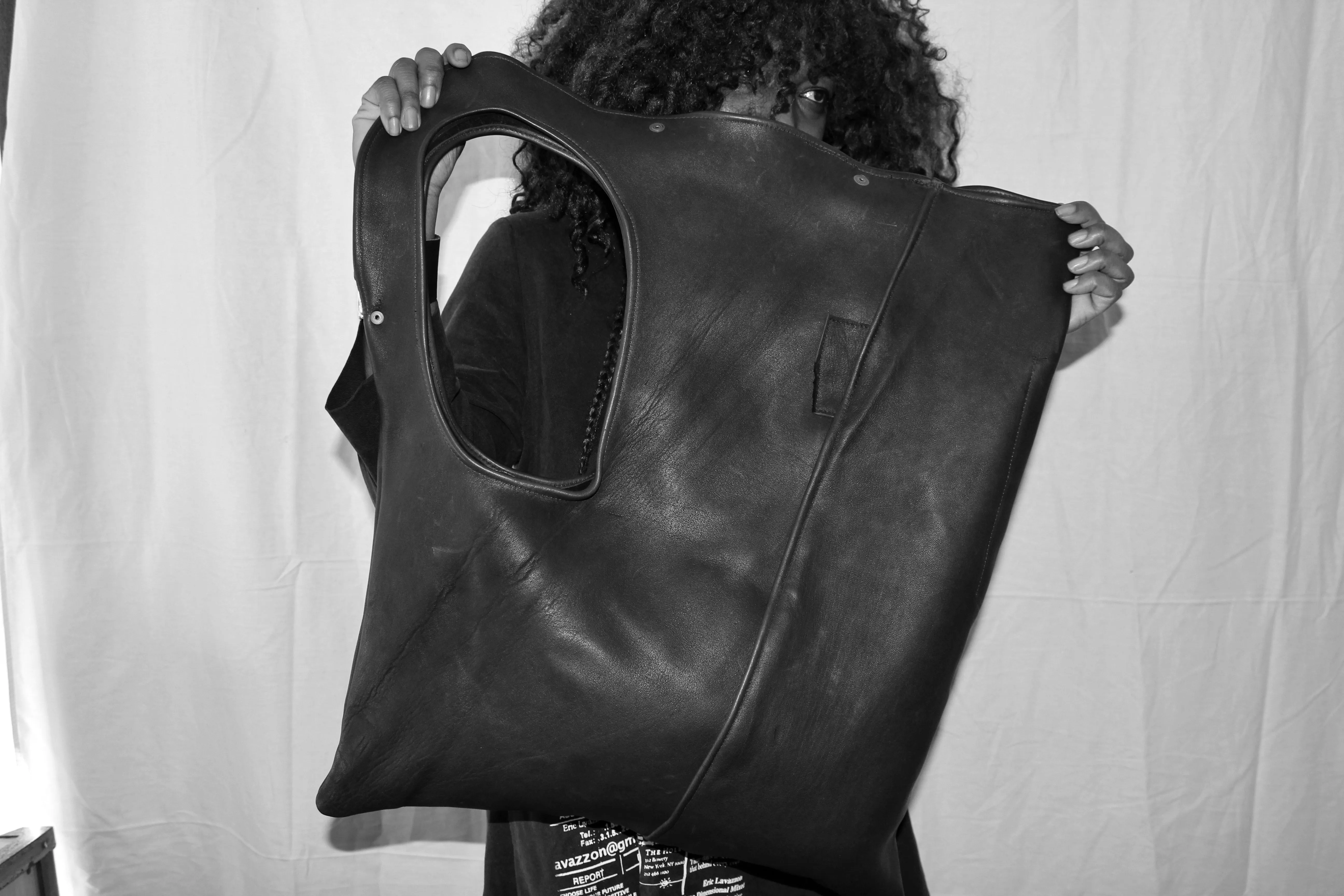 Asymmetrical leather bag solid black or with eye print