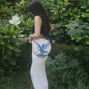 Round crossbody handbag with eagle